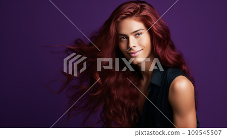 Handsome young male guy smile Asian with long red hair, on purple background, banner, copy space 109545507