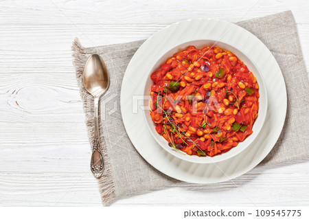 chakalaka, spicy tomato bean relish in white bowl 109545775