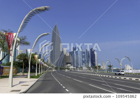 Qatar, Doha, road leading towards skyscrapers with advertising for Expo 2023, horticultural exhibition Qatar, Doha, road leading towards skyscrapers with advertising for Expo 2023, horticultural exhibition 109545862
