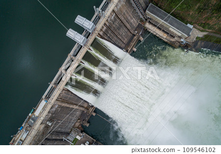 Aerial top down view of water discharge at hydroelectric power plant Aerial top down view of water discharge at hydroelectric power plant 109546102