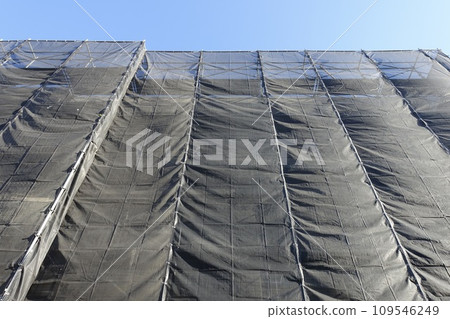 Scaffolding and mesh sheets for condominium repair work Scaffolding and mesh sheets for condominium repair work 109546249