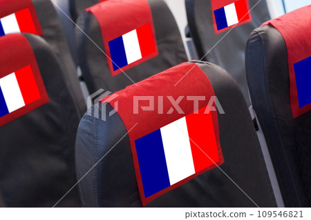 French Flag on Empty seat in plane. Travel, flight and transportration in France concept French Flag on Empty seat in plane. Travel, flight and transportration in France concept 109546821