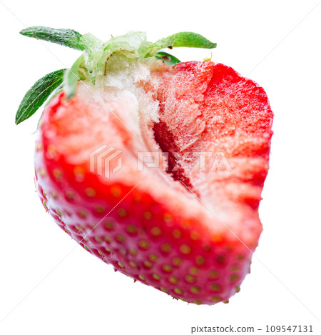 Ripe half of a strawberry on a white background. Ripe half of a strawberry on a white background. 109547131