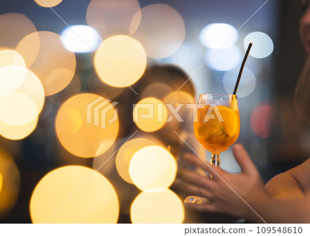 Beverages at the Bar - orange drink in the glass Beverages at the Bar - orange drink in the glass 109548610