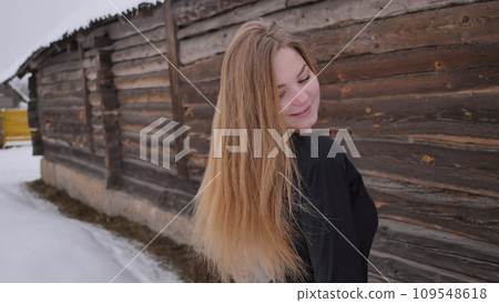 A young schoolgirl with no cues poses in winter. A young schoolgirl with no cues poses in winter. 109548618