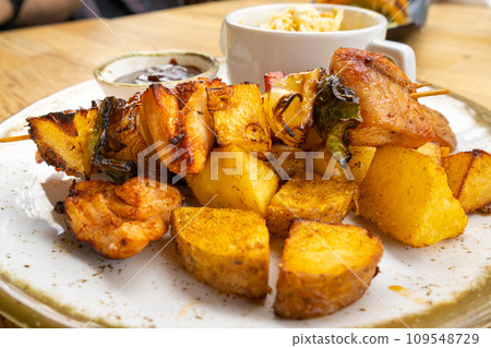 Poultry Shish Kebab, Barbecue Shashlik with Meat and Vegetables, Fruits, Peppers, Onions and Pineapple 109548729
