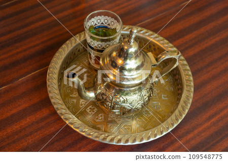 Moroccan Mint Tea in Teapot and Glass Moroccan Mint Tea in Teapot and Glass 109548775