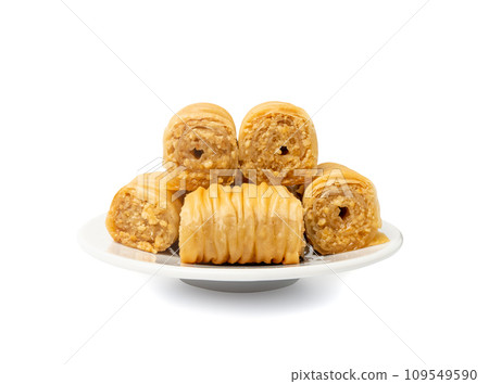 Rolled Baklava Isolated, Ramadan Dessert Roll on Restaurant Plate, Eastern Sweet Pastries Rolled Baklava Isolated, Ramadan Dessert Roll on Restaurant Plate, Eastern Sweet Pastries 109549590