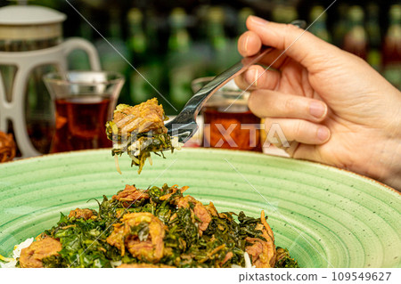 Pilau on Green Plate, Beef Pilaf, Traditional Asian Dish Plov also known as Polow, Pilav, Pallao, Pulao, Palaw Pilau on Green Plate, Beef Pilaf, Traditional Asian Dish Plov also known as Polow, Pilav, Pallao, Pulao, Palaw 109549627