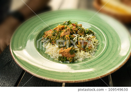 Pilau on Green Plate, Beef Pilaf, Traditional Asian Dish Plov also known as Polow, Pilav, Pallao, Pulao, Palaw Pilau on Green Plate, Beef Pilaf, Traditional Asian Dish Plov also known as Polow, Pilav, Pallao, Pulao, Palaw 109549630