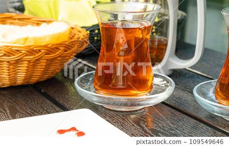 Turkish Tea on a Street Cafe Table, Arabic Cup in Restaurant, Black Tea Drinking in Turkish Cup 109549646