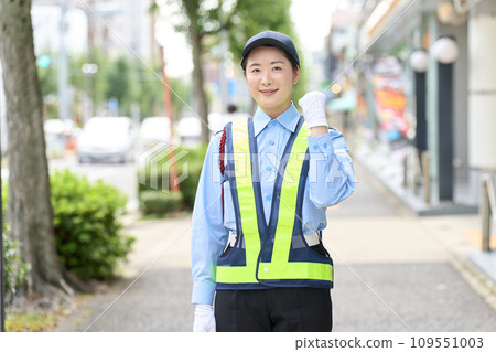 A female security guard doing a fist pump A female security guard doing a fist pump 109551003