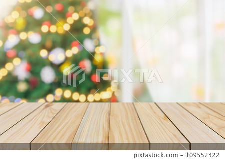 Empty table top with blurred Christmas tree with bokeh light background Empty table top with blurred Christmas tree with bokeh light background 109552322