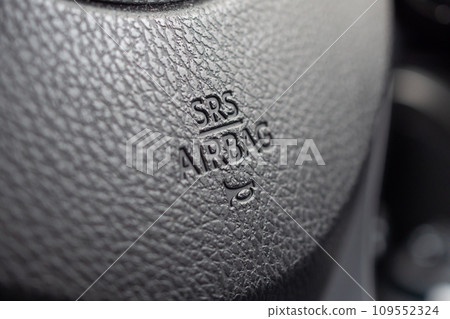 Safety airbag sign on car steering wheel with horn icon 109552324