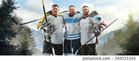 Victory. Hockey winners. Three hockey players stand hugging each other in a friendly atmosphere. Hockey friendship. Sports emotions 109553165