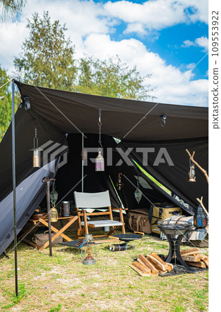 Camping image Blue sky Black tent Tent setup Solo camping Camping image Blue sky Black tent Tent setup Solo camping 109553922