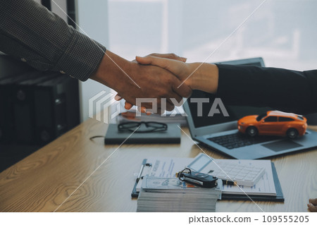 Salesman send key to customer after good deal agreement, successful car loan contract buying or selling new vehicle. 109555205