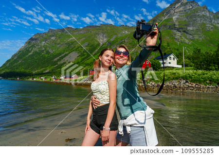 Woman Taking a Selfie with a Professional Camera in a Stylish Urban Setting Woman Taking a Selfie with a Professional Camera in a Stylish Urban Setting 109555285