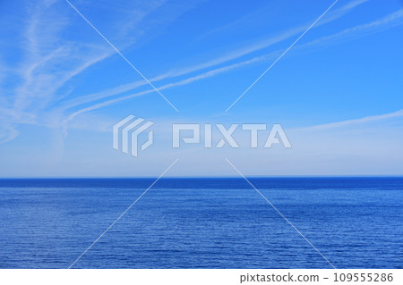 Tranquil Blue Sea and Sky Stretching to the Horizon, Ideal for Promotional Advertisements Tranquil Blue Sea and Sky Stretching to the Horizon, Ideal for Promotional Advertisements 109555286