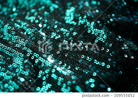 Christmas abstract background made of emerald green sequins. Christmas abstract background made of emerald green sequins. 109555852