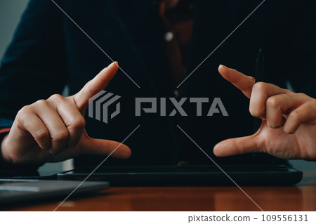 Asian Businesswoman Using laptop computer and working at office with calculator document on desk, doing planning analyzing the financial report, business plan investment, finance analysis concept. 109556131
