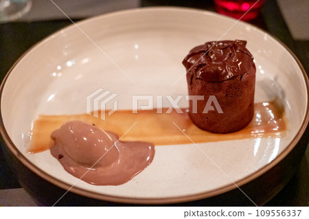Chocolate Lava served on plate with chocolate ice-cream 109556337