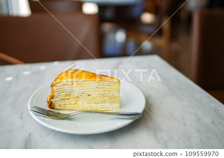 Mille crepes on a cafe table 109559970