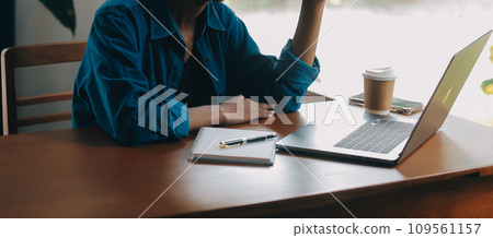 Portrait of Young Asian woman hand freelancer is working her job on computer tablet in modern office. Doing accounting analysis report real estate investment data, Financial and tax systems concept. Portrait of Young Asian woman hand freelancer is working her job on computer tablet in modern office. Doing accounting analysis report real estate investment data, Financial and tax systems concept. 109561157