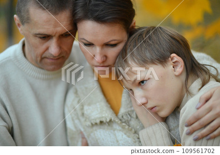 Portrait of a family of three on the nature Portrait of a family of three on the nature 109561702