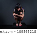 Photo of the brunette woman squatting with yellow anaconda 109565218