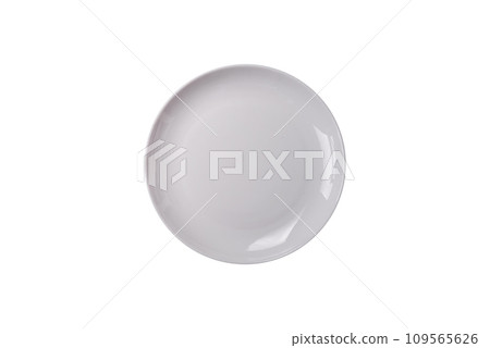 Bumpy empty ceramic plate on a textured concrete background 109565626