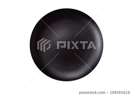 Bumpy empty ceramic plate on a textured concrete background 109565628