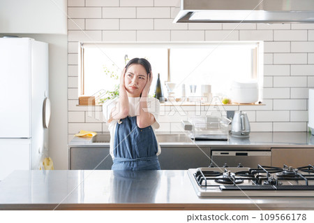 A woman thinking in the kitchen A woman thinking in the kitchen 109566178