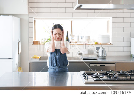 A woman thinking in the kitchen A woman thinking in the kitchen 109566179