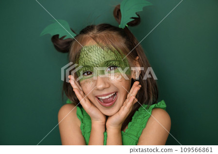 Enthusiastic girl with dragon makeup rejoices at the arrival of new year 2024 Enthusiastic girl with dragon makeup rejoices at the arrival of new year 2024 109566861