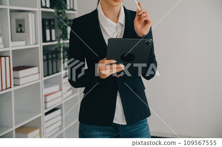 Young friendly operator woman agent with headsets working in a call centre. 109567555