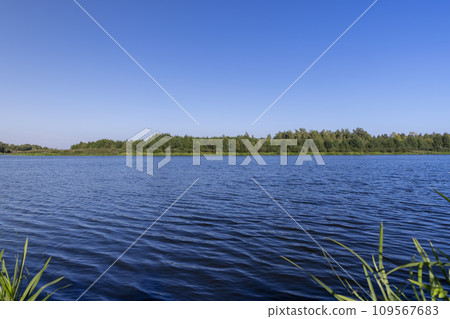 a wide river in sunny weather in early autumn 109567683