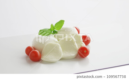 Mozzarella cheese, red tomatoes, green basil on a white background 109567738