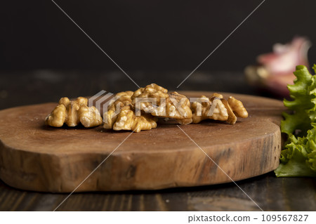 Walnut kernel on the kitchen table during cooking 109567827