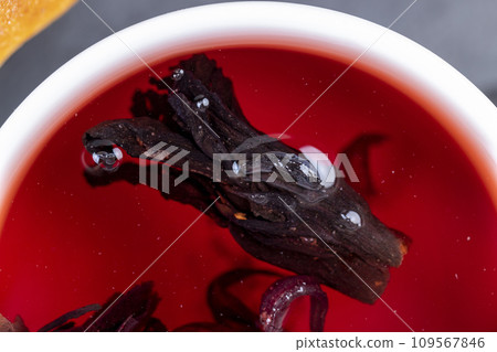 delicious red tea from rose buds on the table delicious red tea from rose buds on the table 109567846