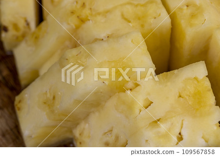 Sliced pieces of ripe yellow pineapple Sliced pieces of ripe yellow pineapple 109567858