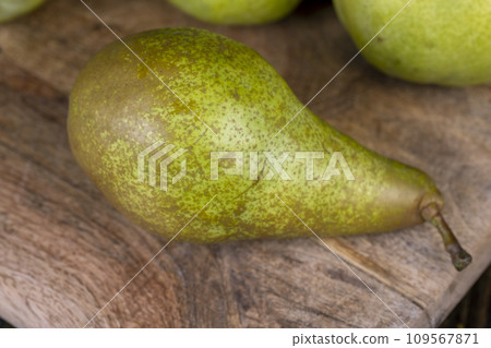 green pear on the table while cooking food green pear on the table while cooking food 109567871