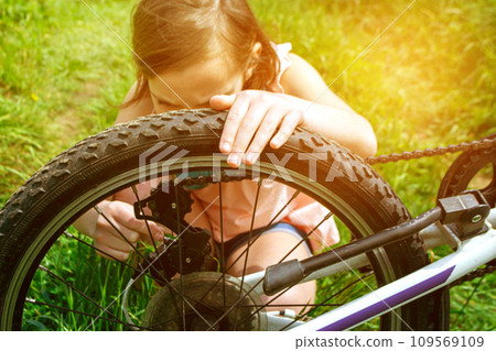 blonde woman with white dress sits on bicycle blonde woman with white dress sits on bicycle 109569109