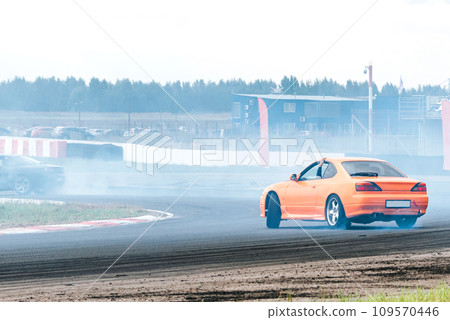 racing car in a skid. drift, tire smoke. sports car. extreme sport racing car in a skid. drift, tire smoke. sports car. extreme sport 109570446