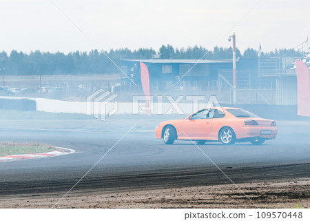 racing car in a skid. drift, tire smoke. sports car. extreme sport racing car in a skid. drift, tire smoke. sports car. extreme sport 109570448