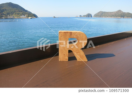 Letter R with sea background Letter R with sea background 109571300