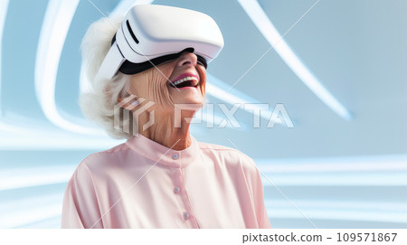 Portrait of a happy smiling enthusiastic Caucasian elderly old, senior woman grey-haired in a virtual reality headset on a blue background. Portrait of a happy smiling enthusiastic Caucasian elderly old, senior woman grey-haired in a virtual reality headset on a blue background. 109571867