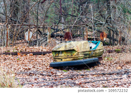 Abandoned bumper cars in the amusement park of Pripyat city in Chernobyl Exclusion Zone, Ukraine 109572232