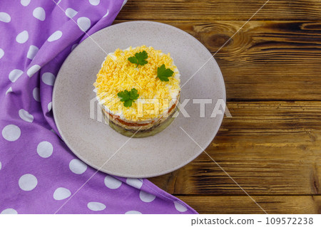 Traditional russian salad Mimosa on wooden table. Top view 109572238