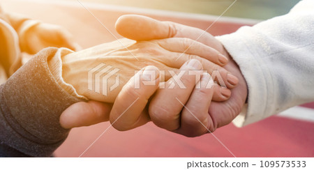 Hands together, man and a woman take care of each other. 109573533